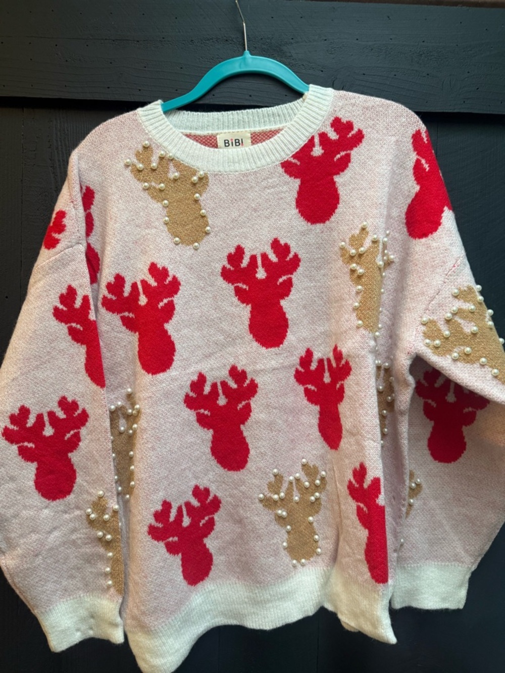 BiBi Pink Crewneck Sweater with Red and Gold Reindeer Motifs